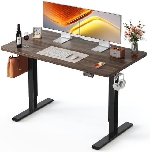 FEZIBO 55 x 24 Inchs Electric Standing Desk, Height Adjustable, Sit Stand Up, Computer Office Desk with Splice Board, Black Frame/Black Walnut Top