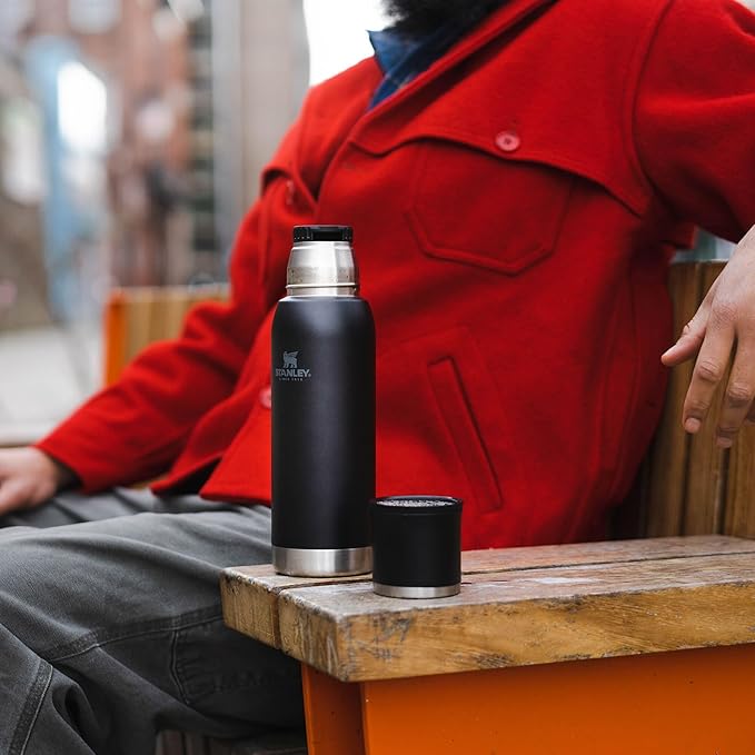 Stanley Adventure-To-Go Vacuum Bottle 1.1 qt | Wide Mouth with Leakproof Cup Lid | Keep Drinks Hot or Cold | Packable for Travel | Insulated Stainless Steel Thermal Bottle | BPA-Free | Black 2.0